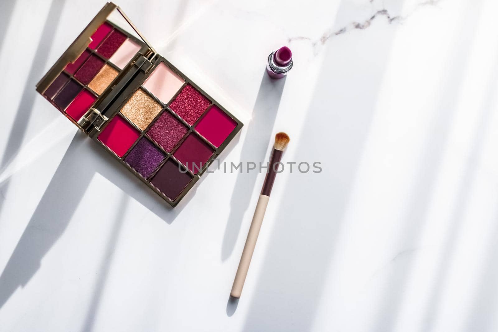 Cosmetic branding, girly and glamour concept - Cosmetics, makeup products set on marble vanity table, lipstick, eyeshadows and make-up brush for luxury beauty and fashion brand ads, holiday design