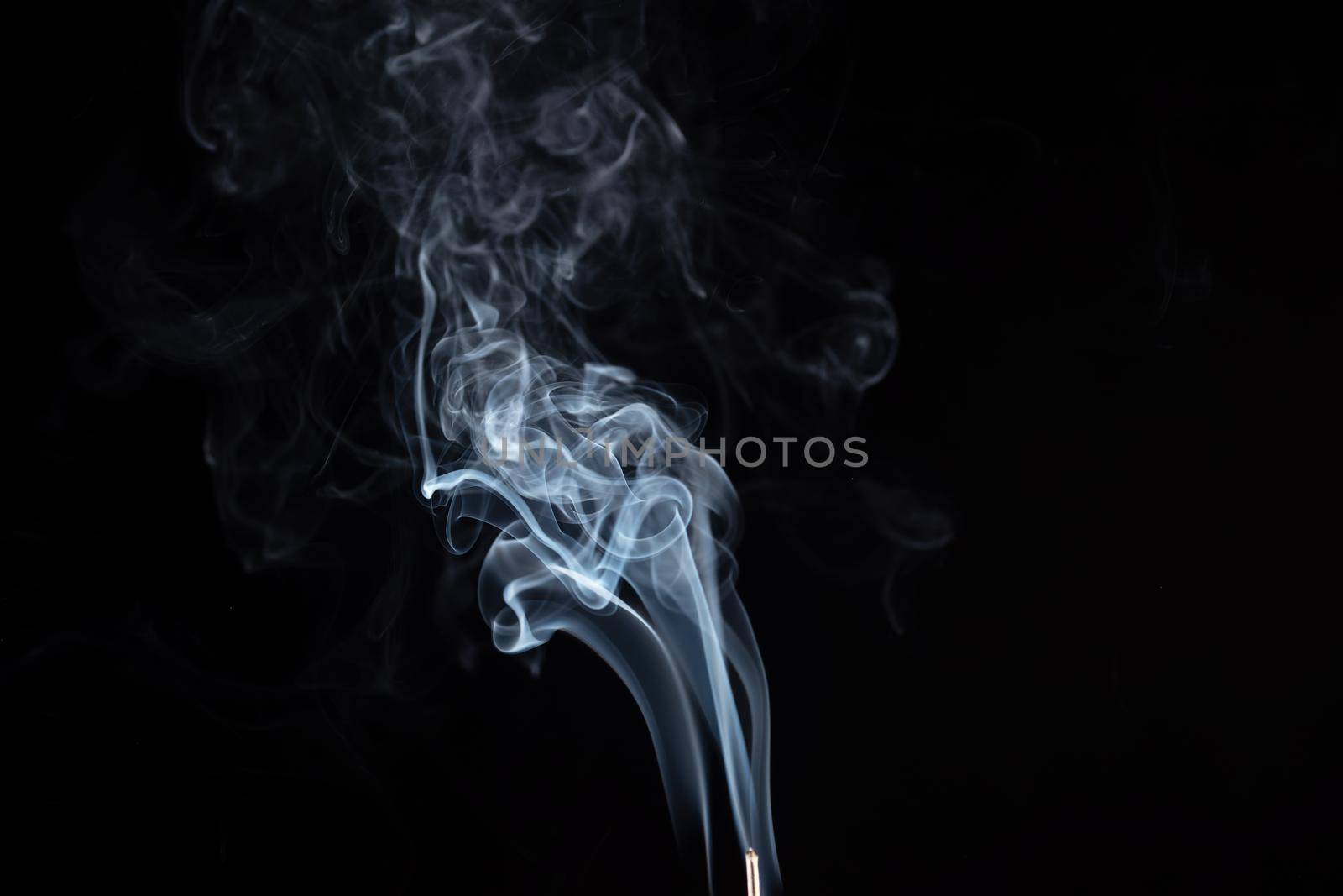 incense stick with smoke against black background by Iryna_Melnyk