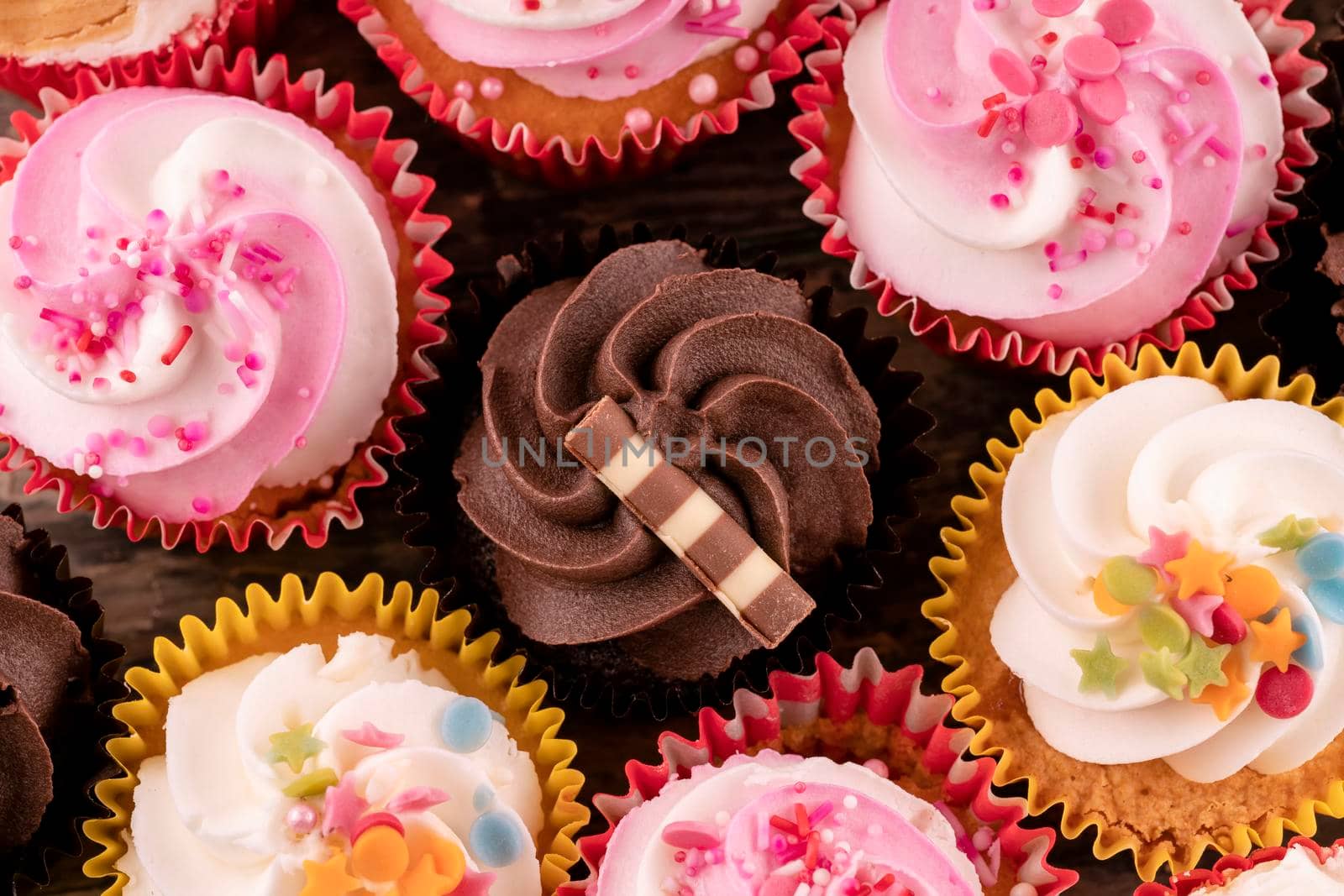 muffins cupcakes on a wooden background high-quality photos for calendar and cards. by Iryna_Melnyk