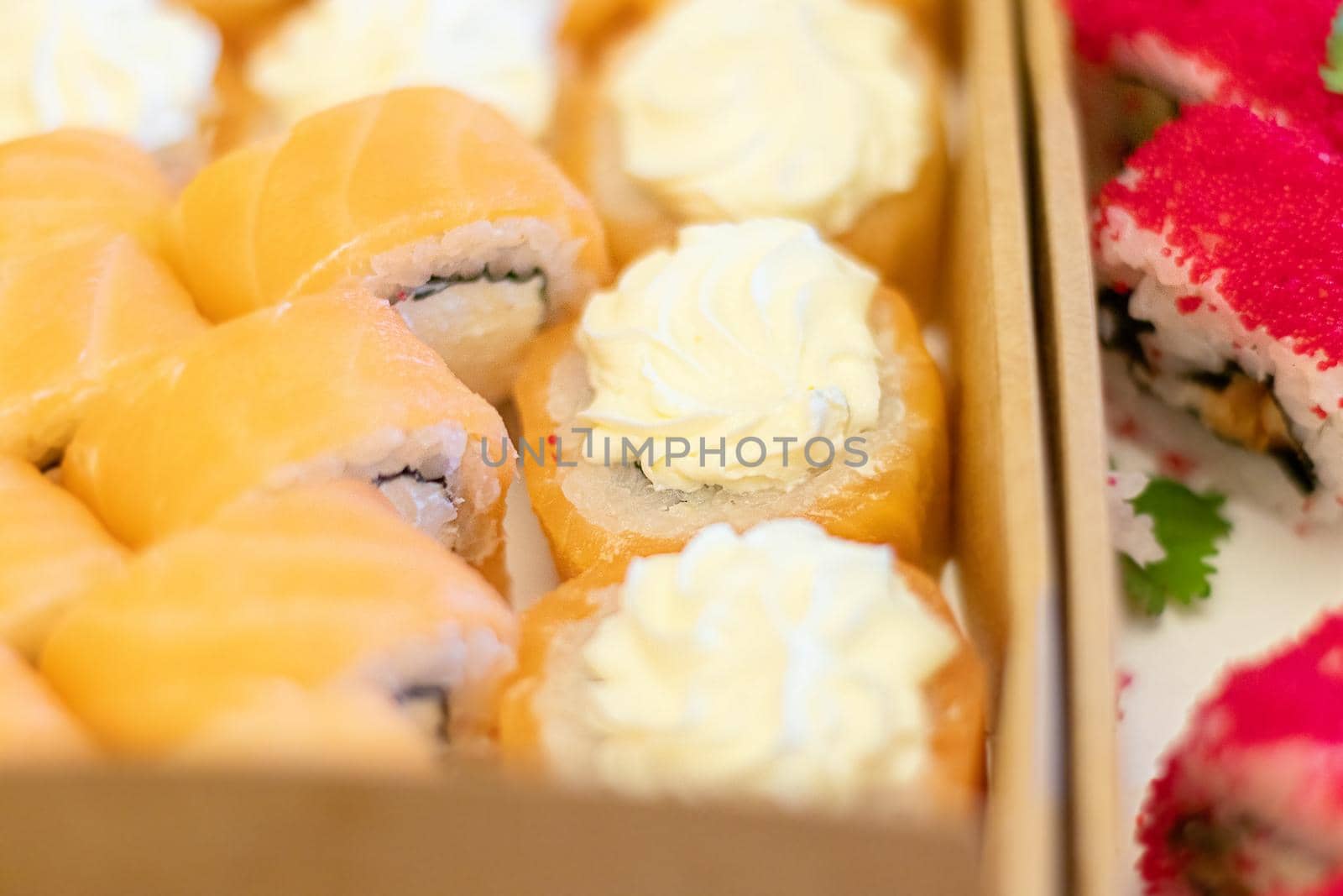 closeup top view japanese sushi or rolls in a box by Leoschka