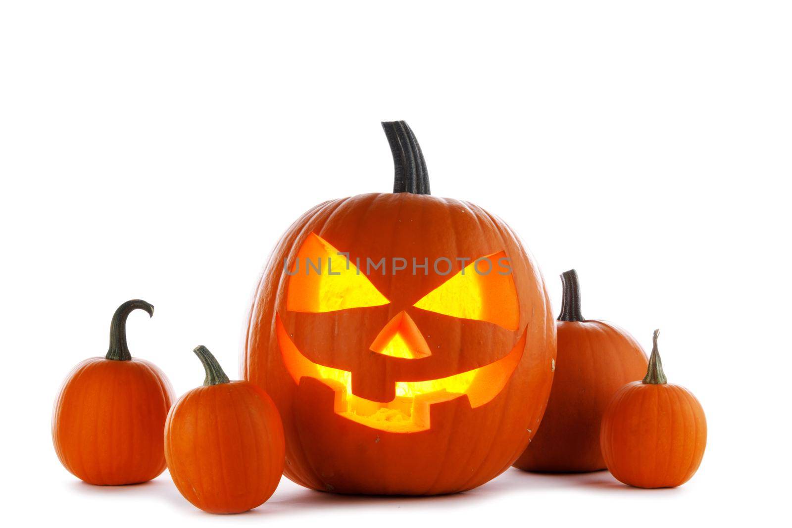 Halloween pumpkins isolated on white background, carved pumpkin with burning candle inside