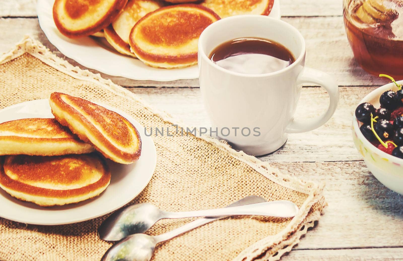 pancakes on a light background. selective focus. by yanadjana