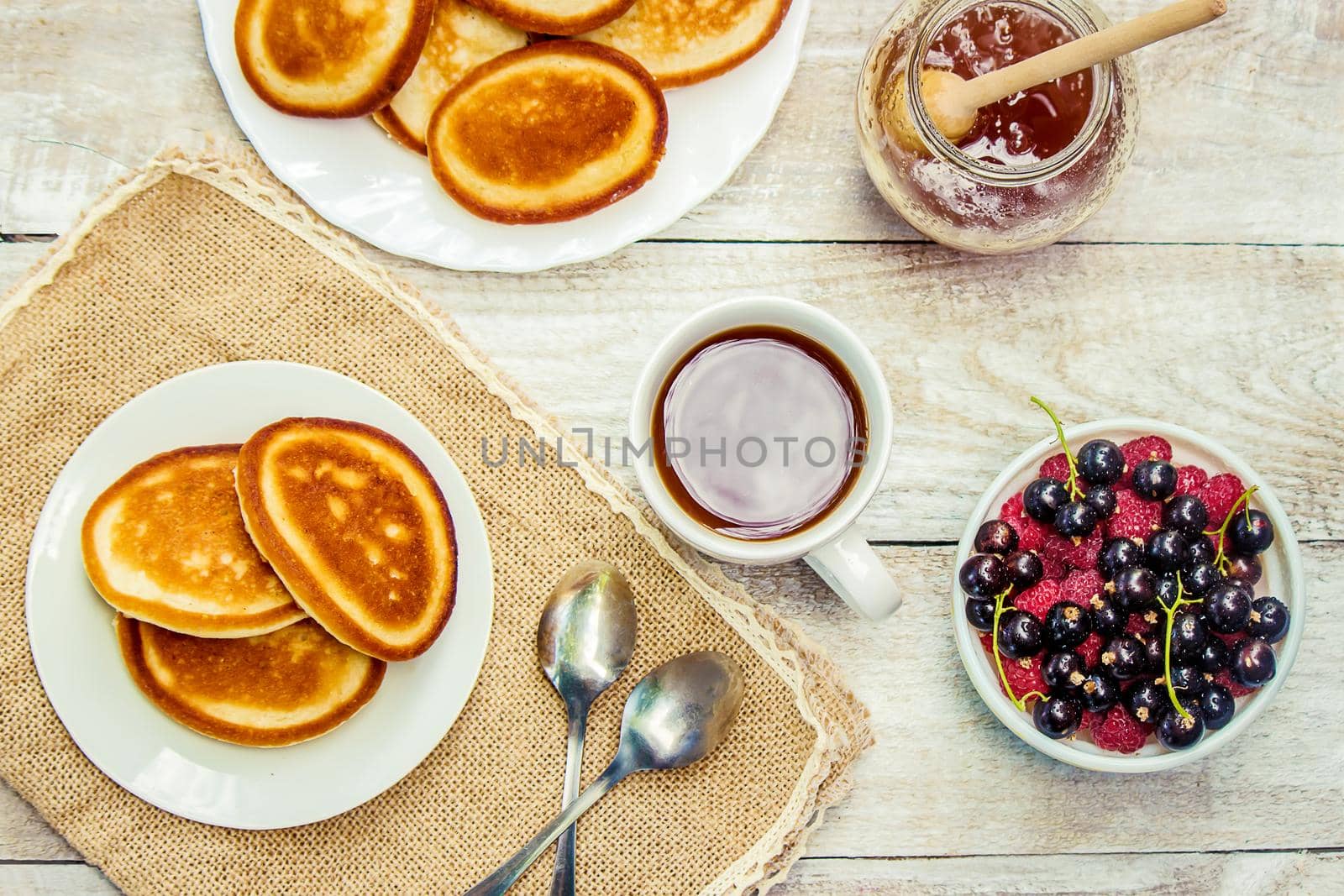 pancakes on a light background. selective focus. by yanadjana