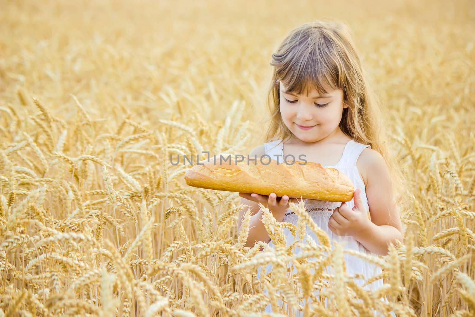 Child and bread. selective focus. food and drink.