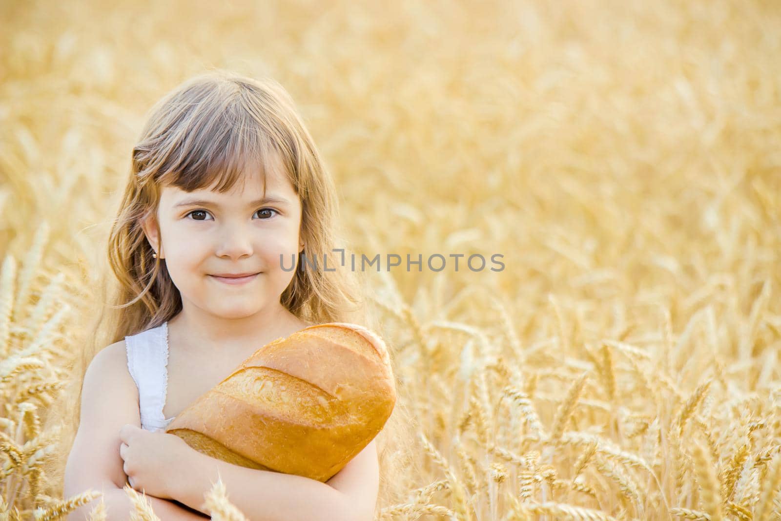 Child and bread. selective focus. food and drink.