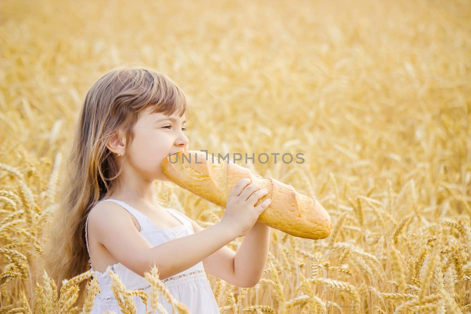 Child and bread. selective focus. food and drink.