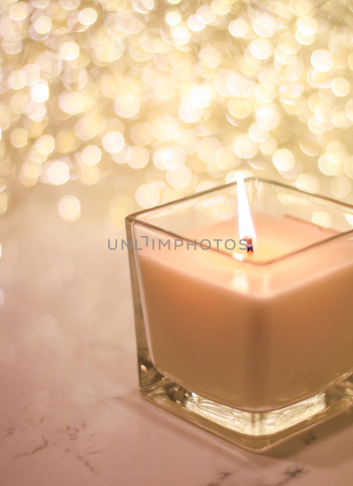 Festive decoration, branding and aromatherapy spa concept - Aromatic candle on golden Christmas and New Years glitter background, Valentines Day luxury home decor and holiday season brand design