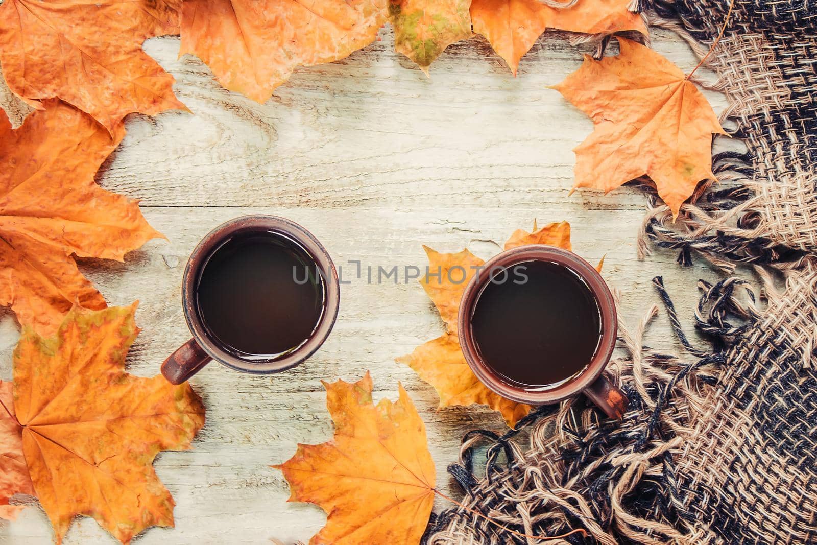 A cup of tea and a cozy autumn background. Selective focus. food.