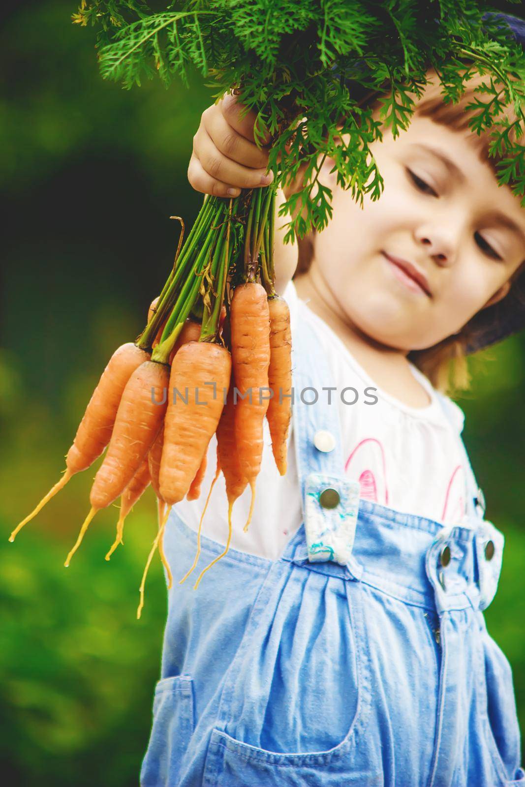 Child and vegetables on the farm. Selective focus. nature.