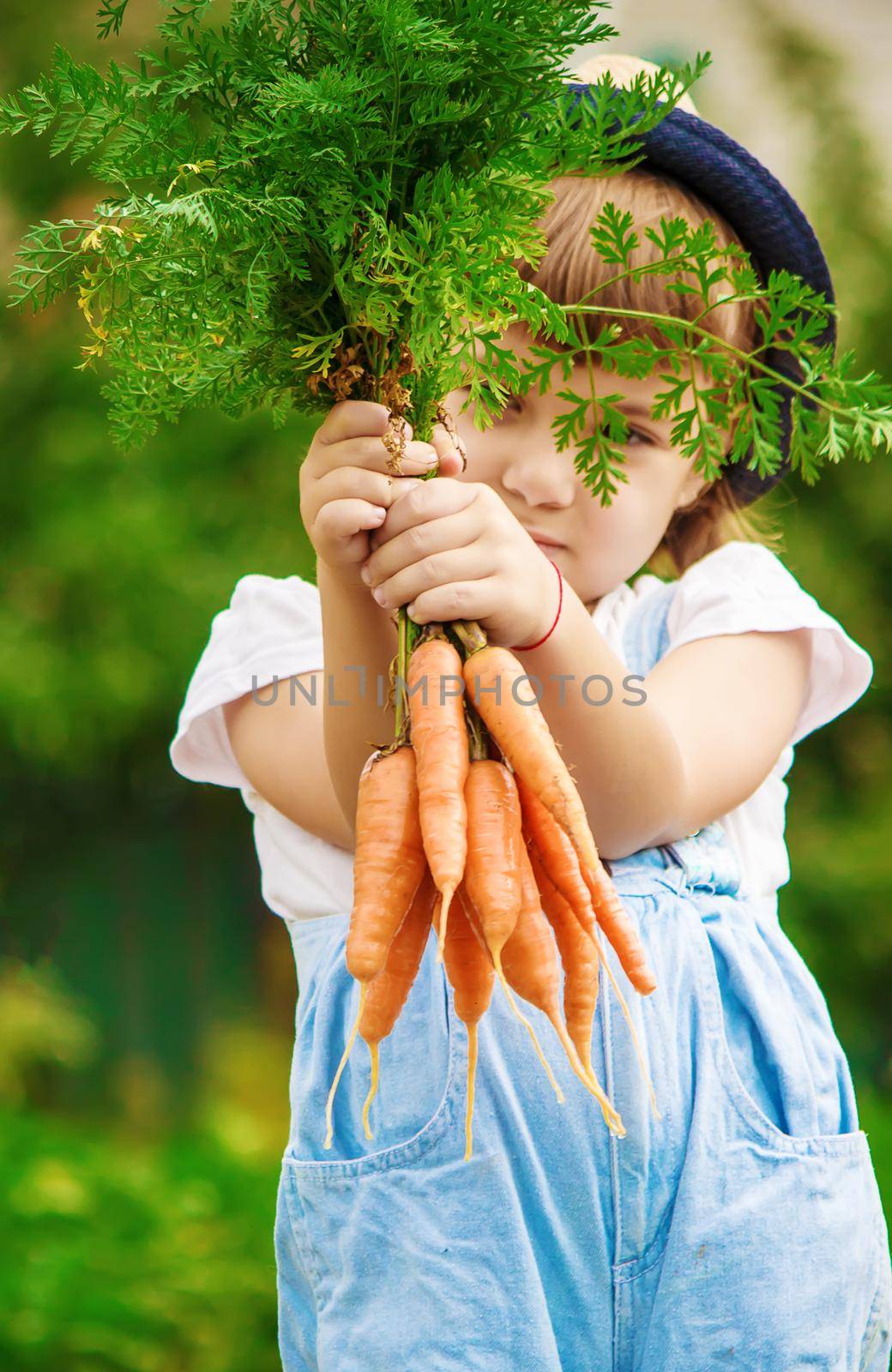 Child and vegetables on the farm. Selective focus. nature.