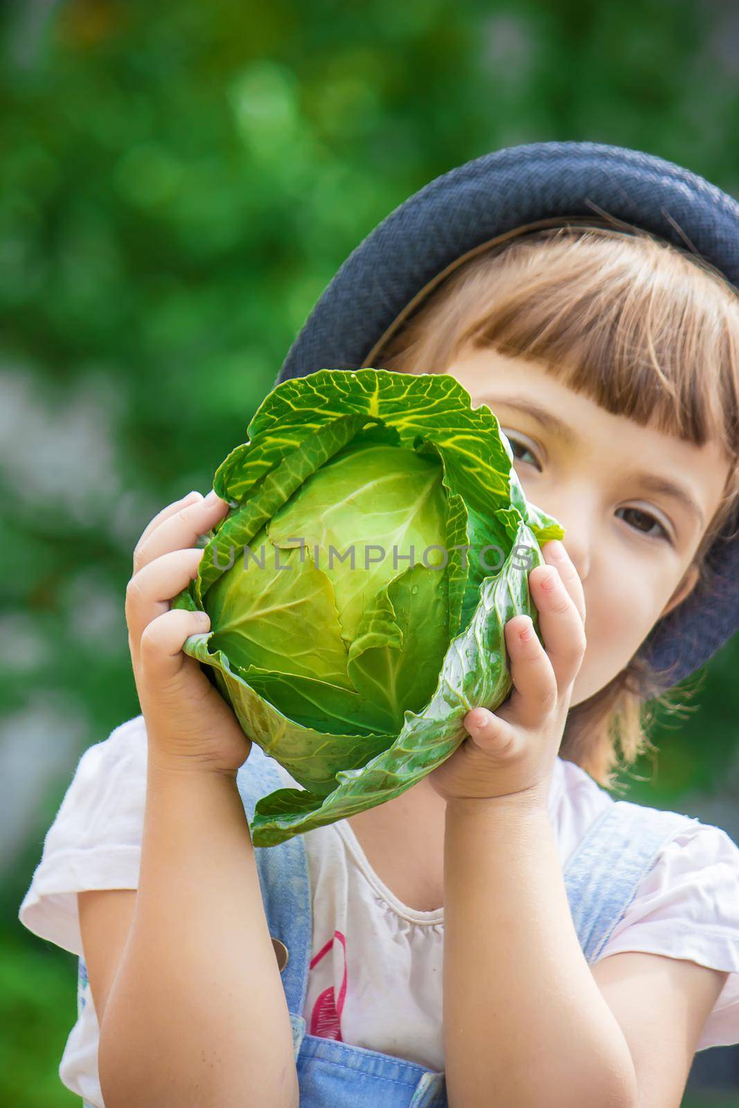 Child and vegetables on the farm. Selective focus. nature.