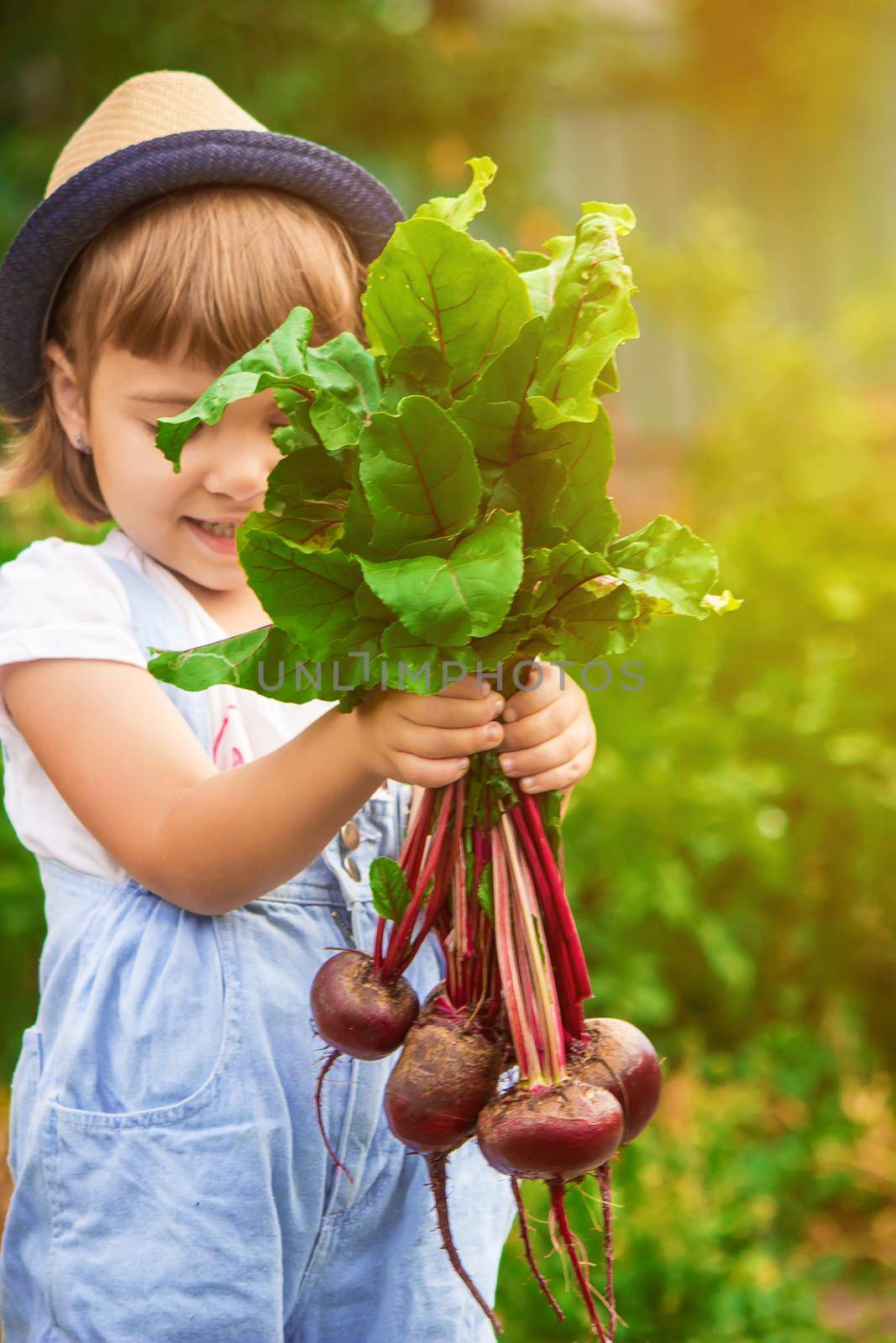 Child and vegetables on the farm. Selective focus. nature.