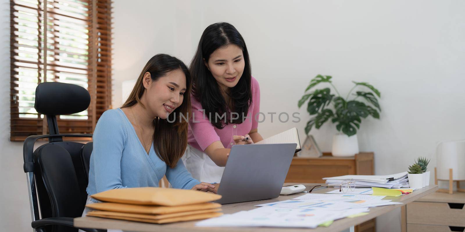 Group of Business woman and Accountant checking data document on laptop for investigation of corruption account. Anti Bribery concept by itchaznong