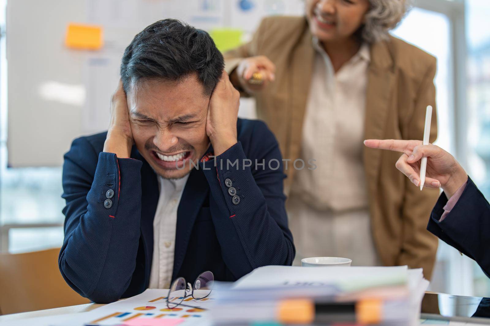 Stressed annoyed office employee having headache migraine at business finance meeting.