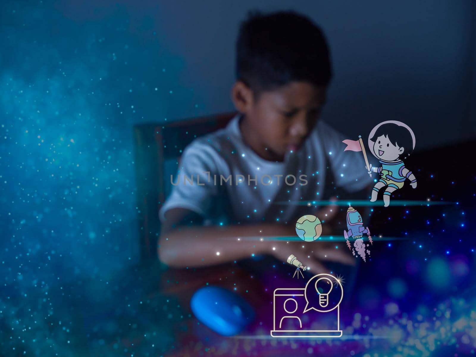 education icon On the background of blurry pictures a boy is staring at a computer monitor. educational concept, educational information search, copy space