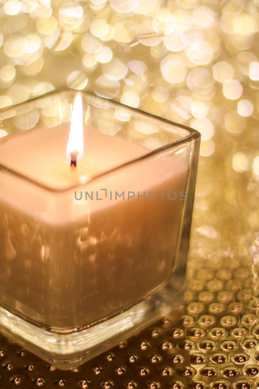 Festive decoration, branding and aromatherapy spa concept - Aromatic candle on golden Christmas and New Years glitter background, Valentines Day luxury home decor and holiday season brand design