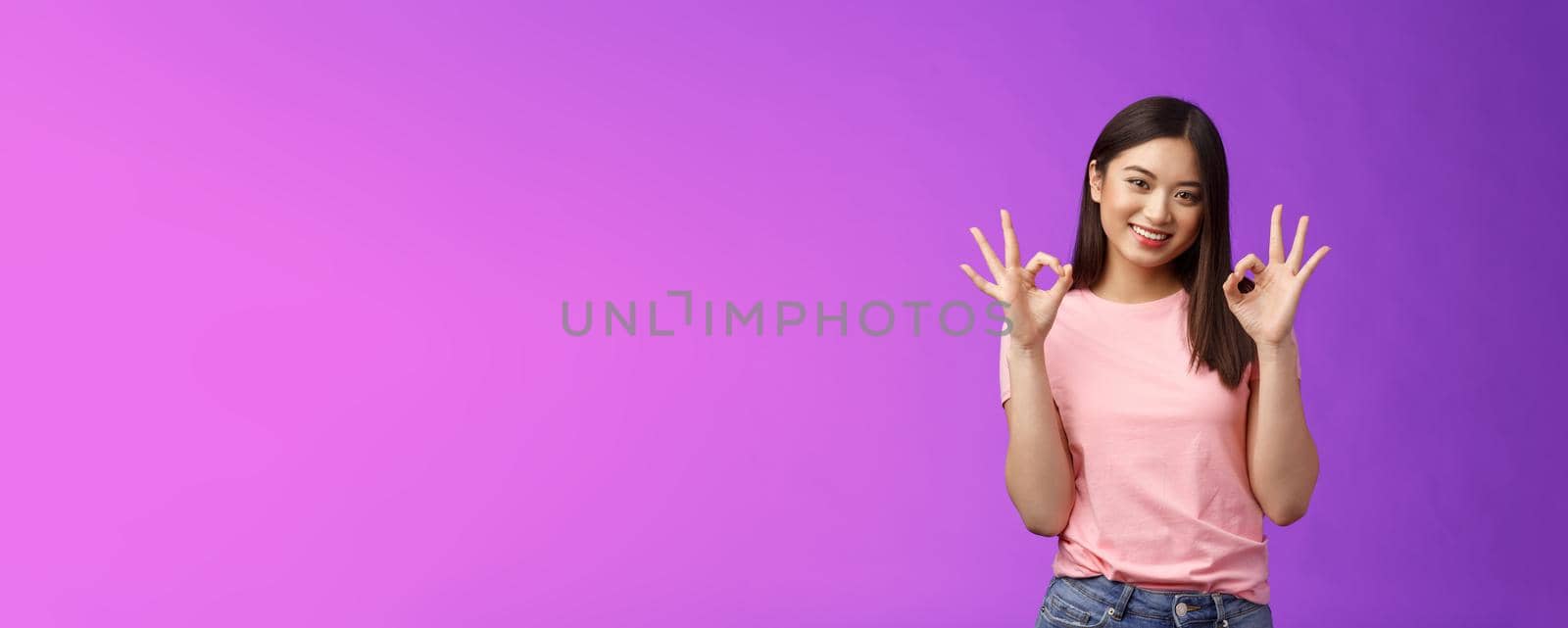 Friendly joyful good-looking stylish asian girl brunette show okay accept sign, smiling delighted feel fine, give recommendation, approve nice choice, stand purple background satisfied by Benzoix