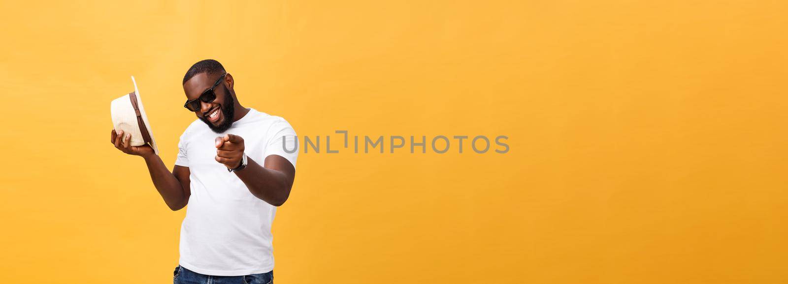 Young black man top dancing isolated on a yellow background. by Benzoix