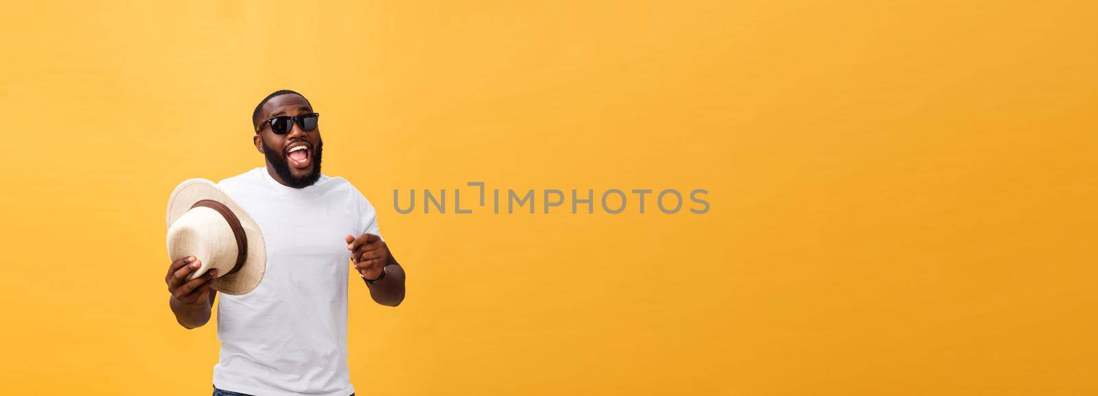 Young black man top dancing isolated on a yellow background. by Benzoix