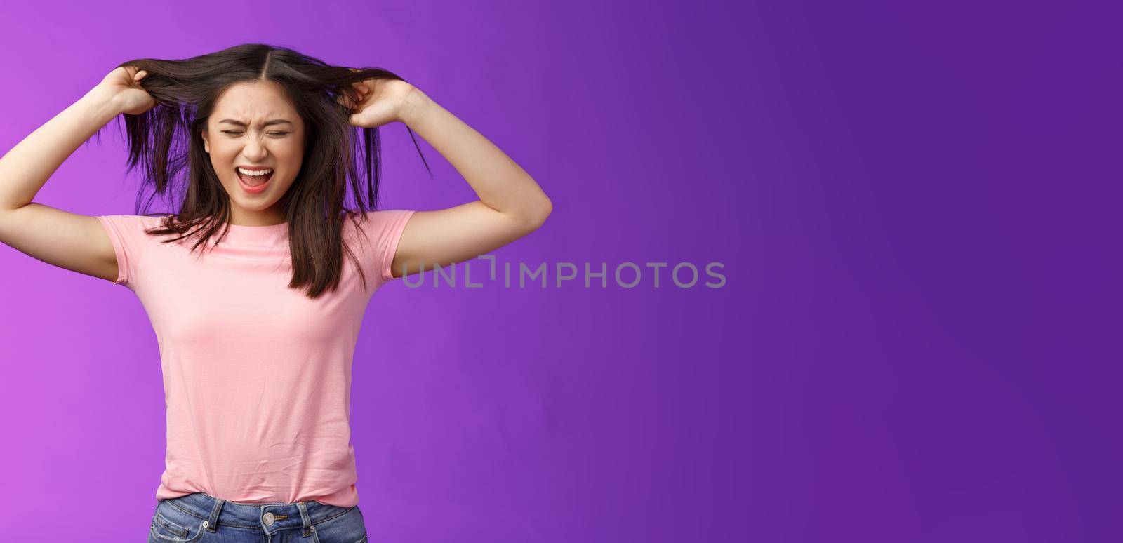 Upset distressed asian brunette girl frowning screaming, pull out hair fed up poor haircare, disappointment weak strands, stand purple background annoyed, pissed complain hairsalon.