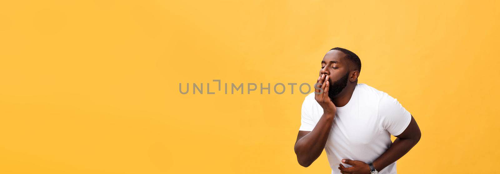 Young african american man wearing white t-shirt with hand on stomach because nausea, painful disease feeling unwell. Ache concept by Benzoix