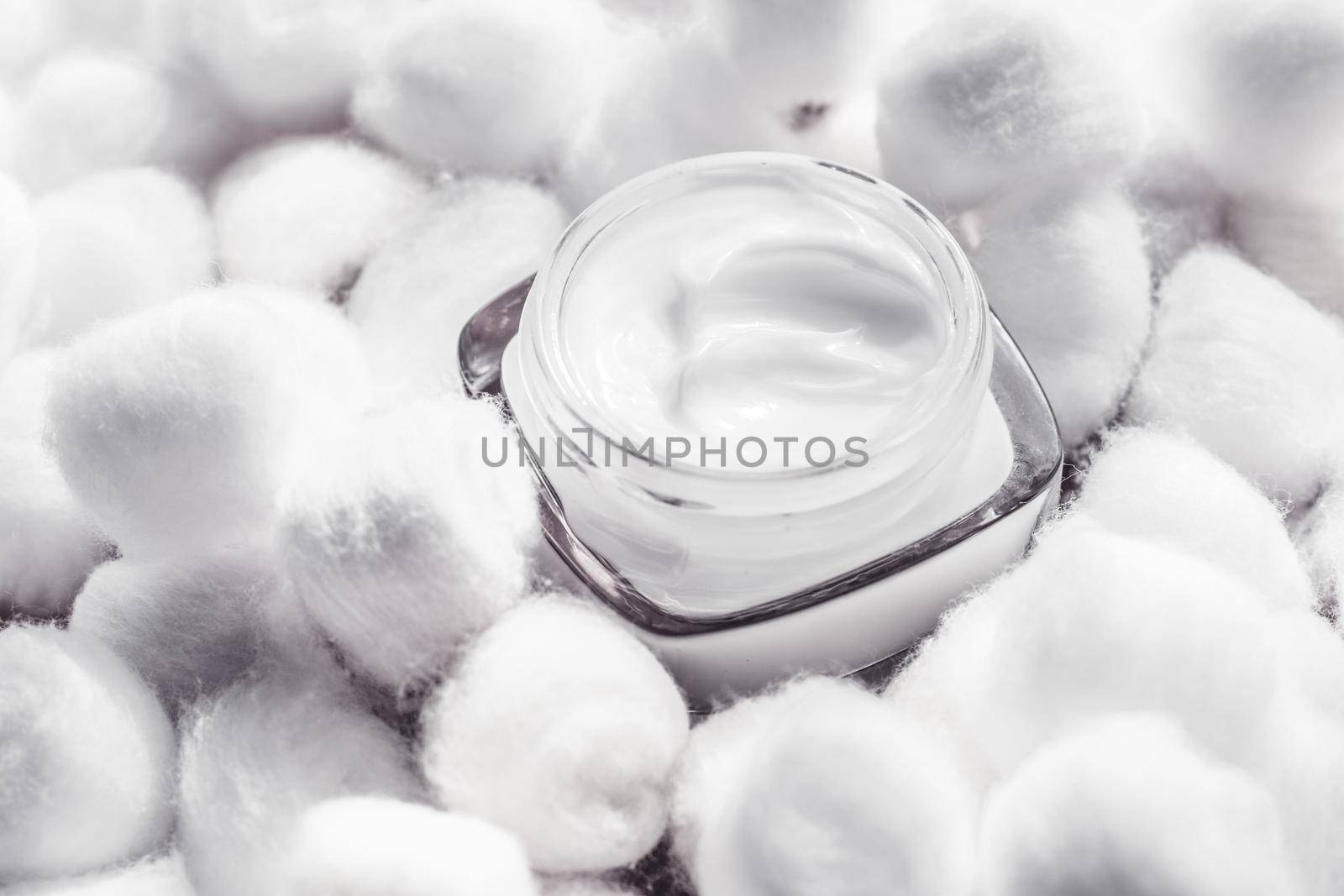 Cosmetic branding, moisturizing emulsion and facial care concept - Luxury face cream for sensitive skin and white cotton balls on background, spa cosmetics and natural skincare beauty brand product