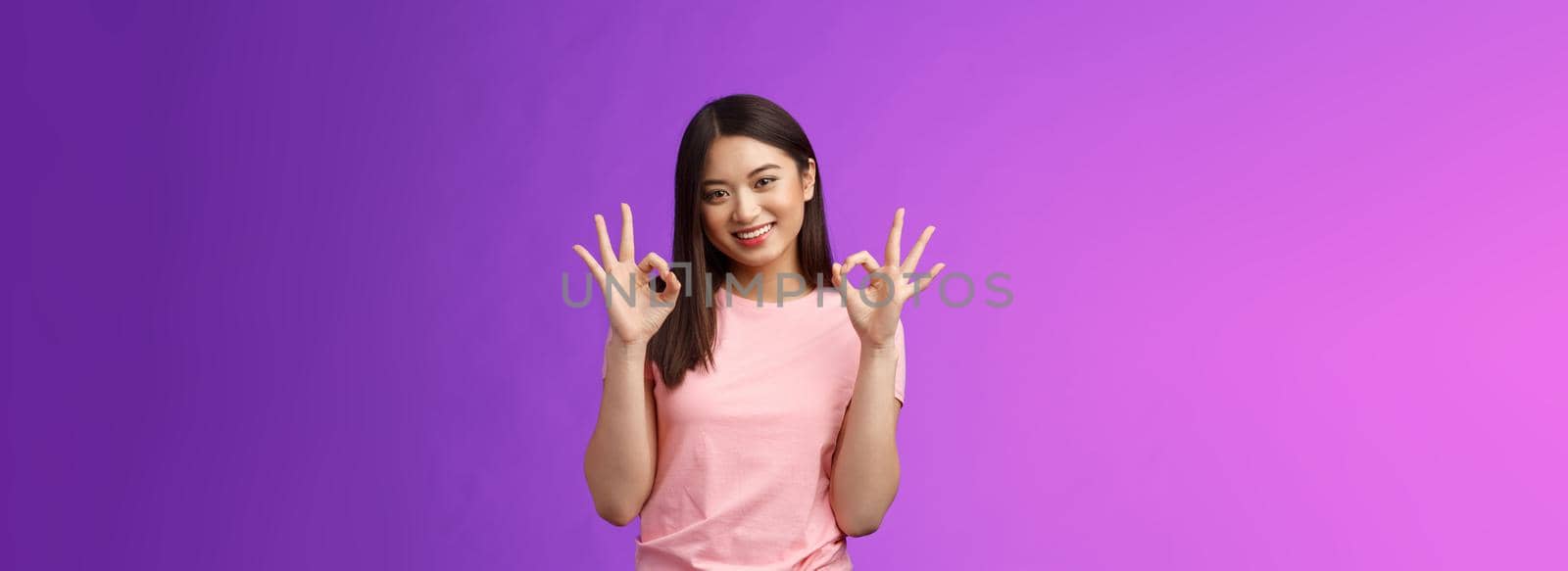 Friendly joyful good-looking stylish asian girl brunette show okay accept sign, smiling delighted feel fine, give recommendation, approve nice choice, stand purple background satisfied by Benzoix