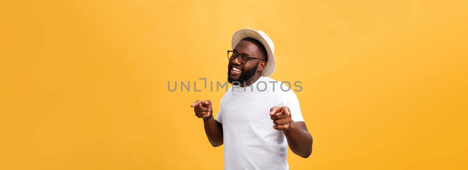 Single handsome muscular Black man with shaved head, folded arms and cheerful expression.