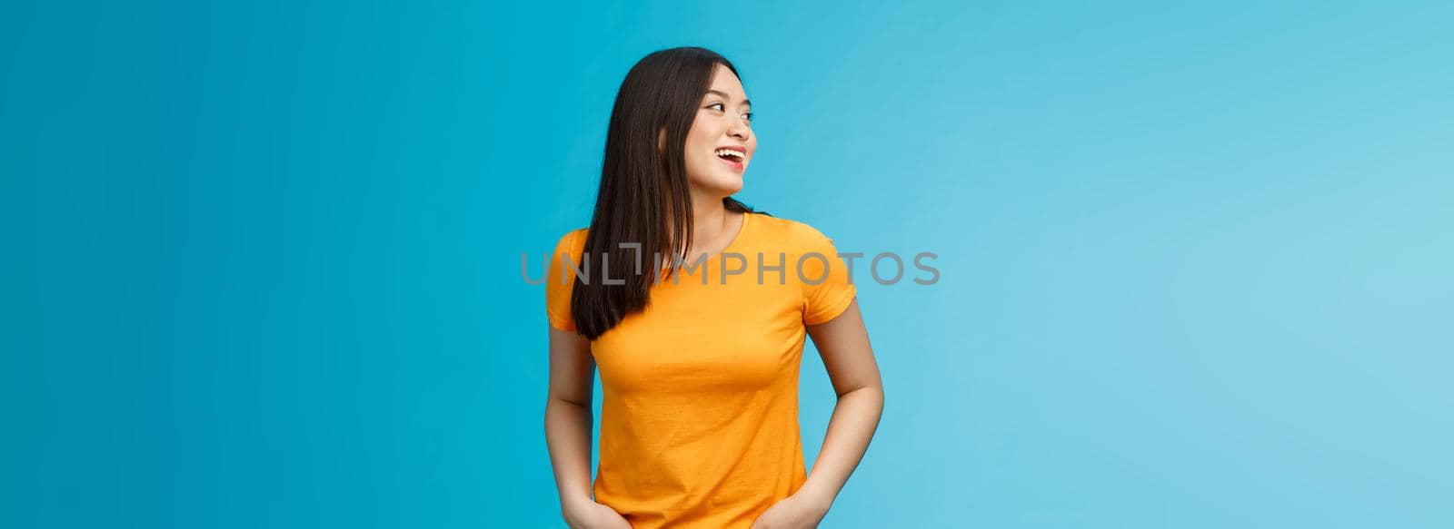 Friendly outgoing stylish female student hanging around friends talking lively enjoy summer party near pool turn left answer question hear someone calling name, smiling joyfully stand carefree by Benzoix