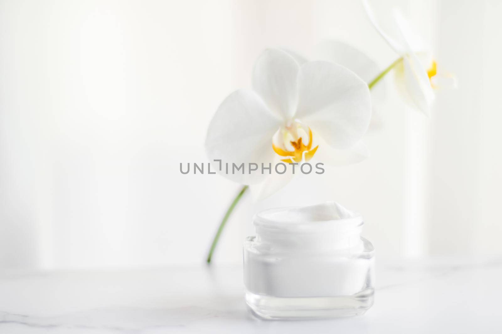 Cosmetic branding, toiletries and spf concept - Face cream moisturizer jar and orchid flower, moisturizing skin care lotion and lifting emulsion, anti-age cosmetics for luxury beauty skincare brand