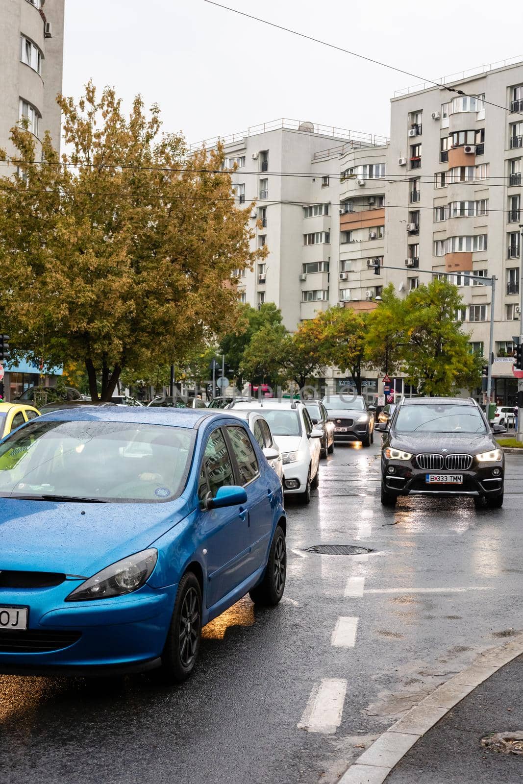 Car traffic at rush hour. Car pollution, traffic jam in Bucharest, Romania, 2022 by vladispas