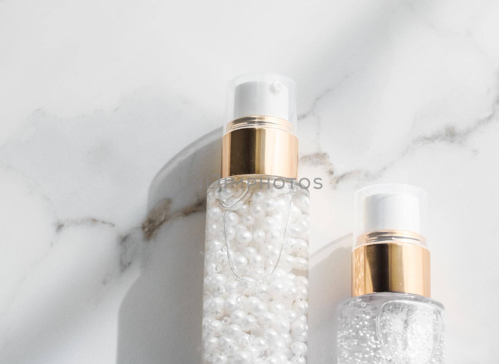 Cosmetic branding, packaging and make-up concept - Skin care serum and gel bottle, moisturizing lotion and lifting cream emulsion on marble, anti-age cosmetics for luxury beauty skincare brand design