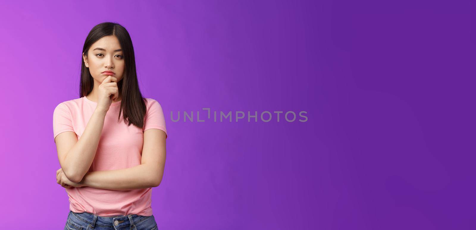 Judgemental serious-looking smart asian girl give expert look, touch chin thoughtful, squinting suspicious uncertain, make decision, choosing product, thinking, pondering plan, purple background by Benzoix