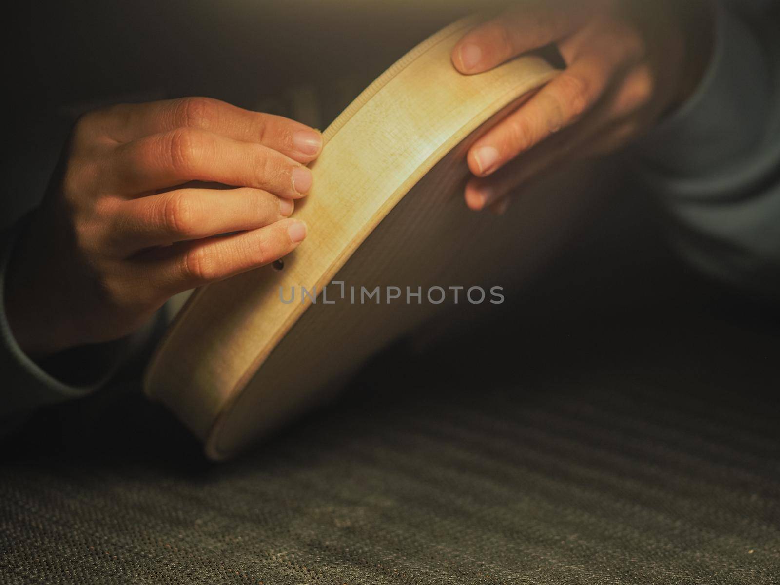 woman violinmaker at work with the fiddle