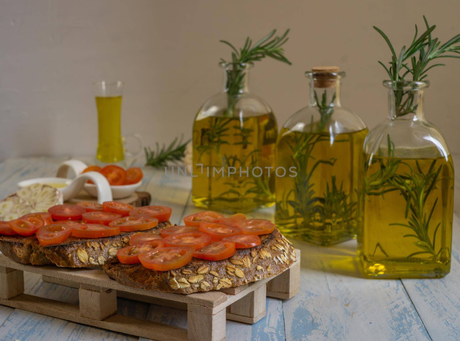 toast bread with cherry tomato and olive oil with rosemary