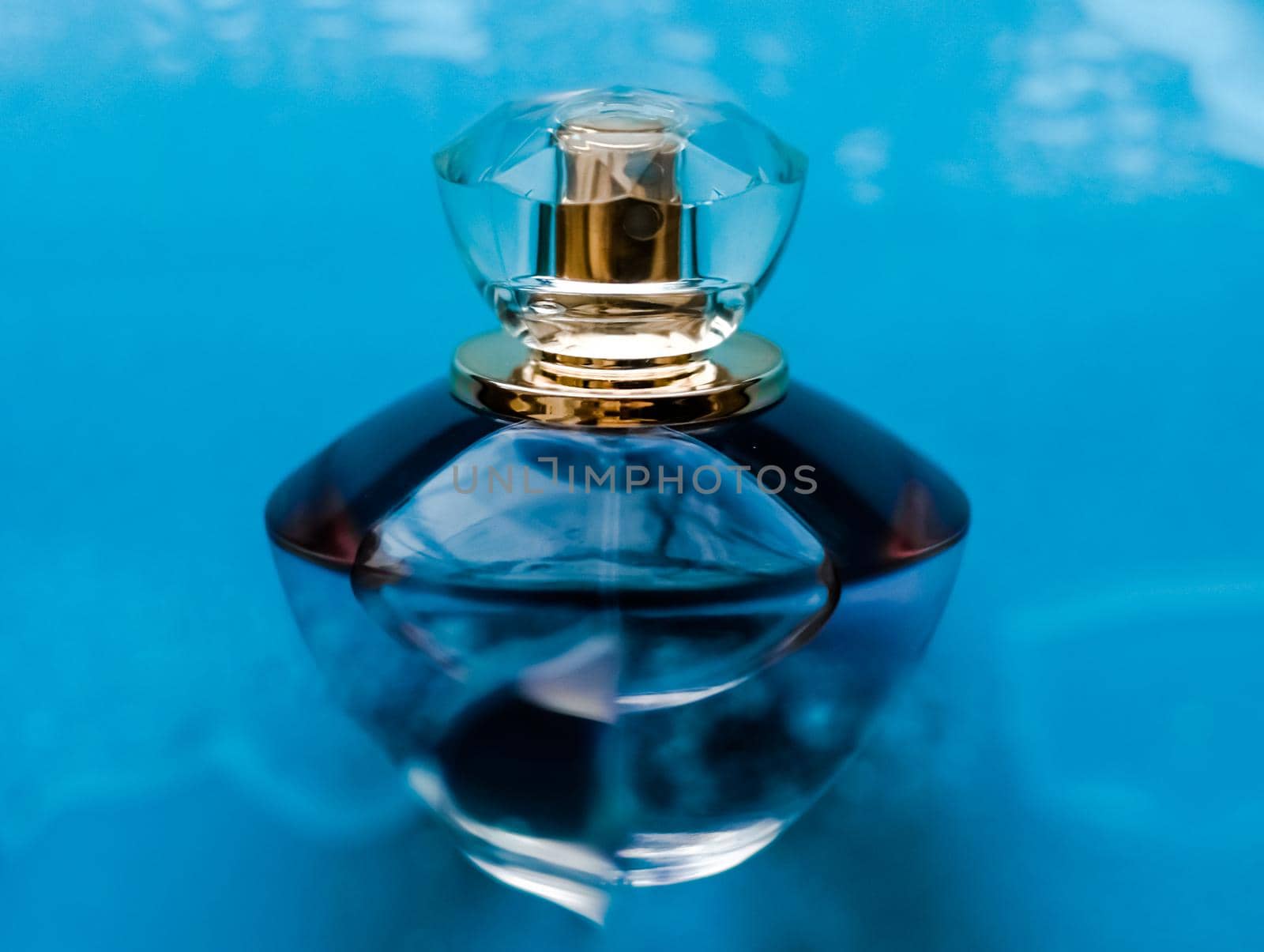 Perfumery, cosmetics and branding concept - Perfume bottle under blue water, fresh sea coastal scent as glamour fragrance and eau de parfum product as holiday gift, luxury beauty spa brand present