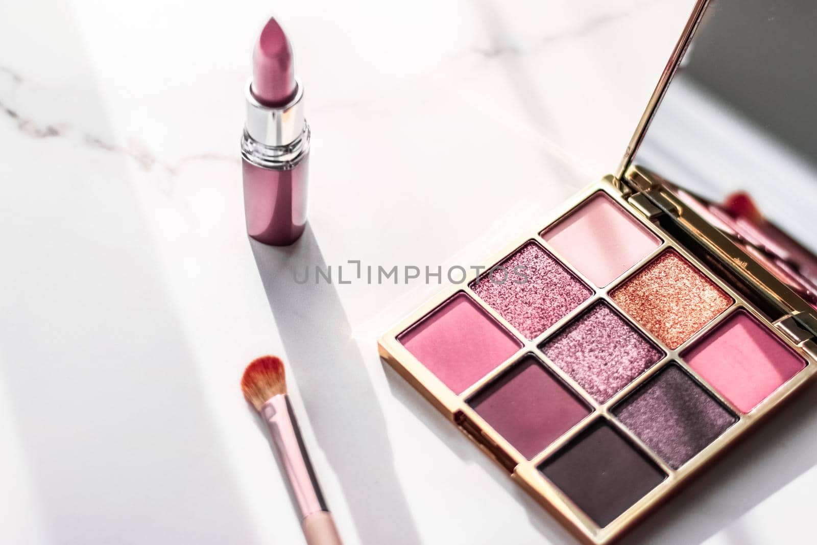Cosmetic branding, girly and glamour concept - Cosmetics, makeup products set on marble vanity table, lipstick, eyeshadows and make-up brush for luxury beauty and fashion brand ads, holiday design