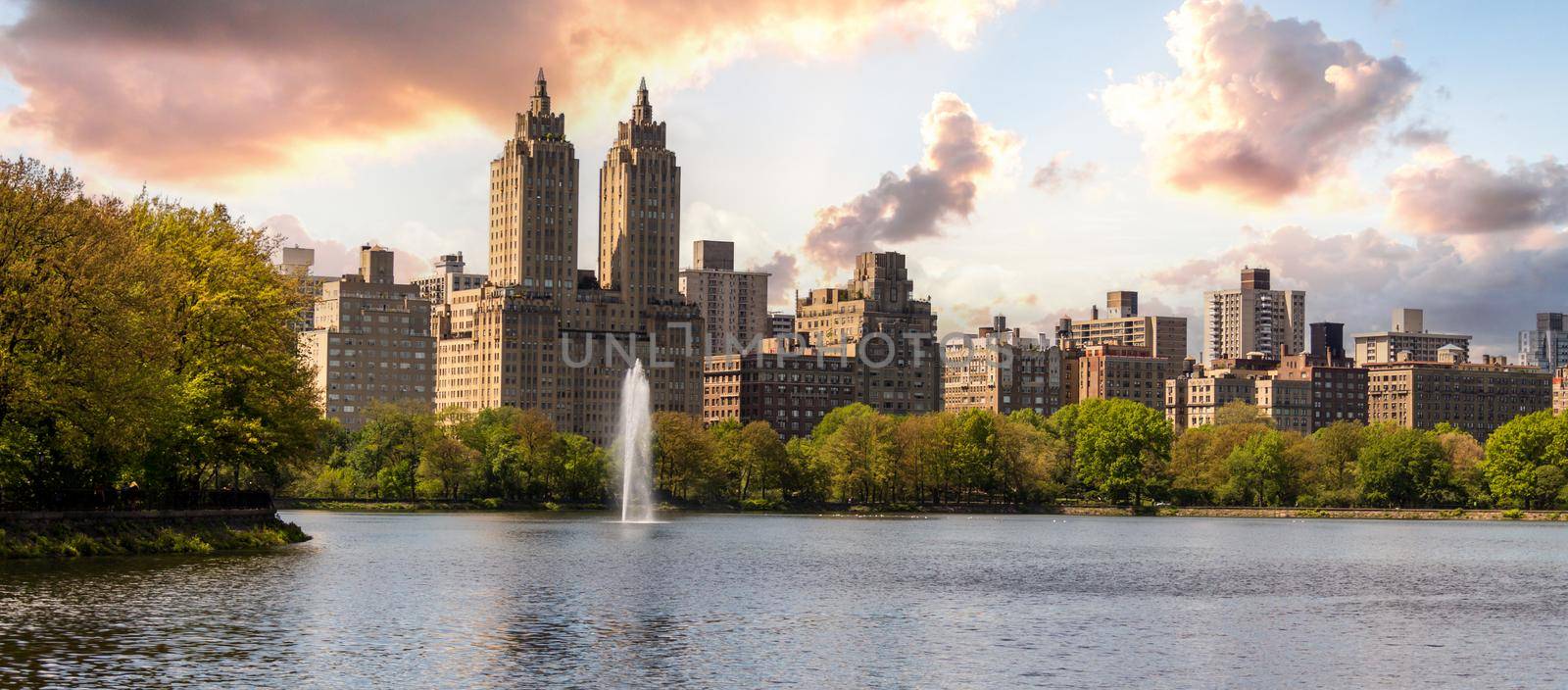 Skyline panorama with Eldorado building and reservoir with fountain in Central Park in midtown Manhattan in New York City by Mariakray
