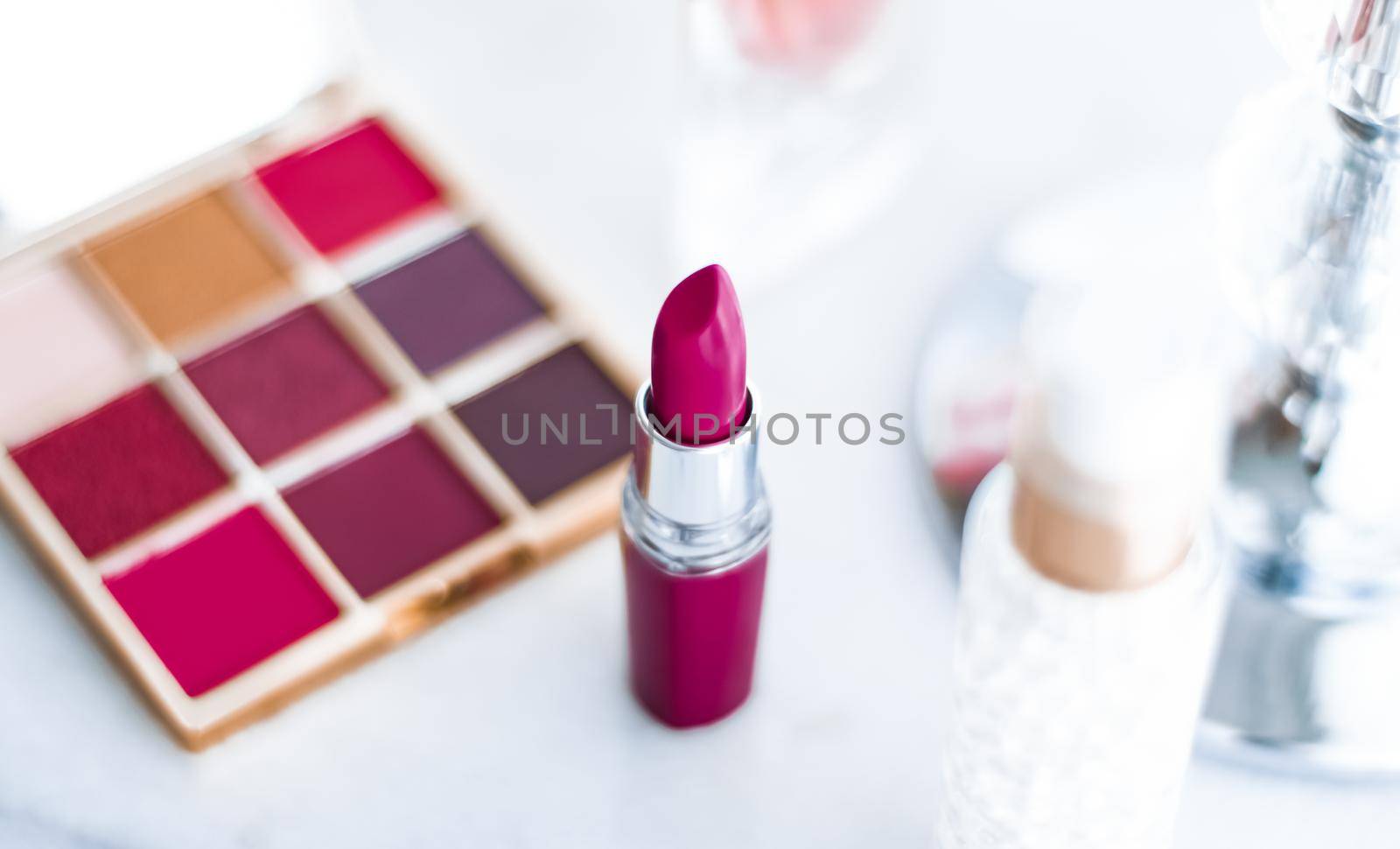 Cosmetic branding, girly and glamour concept - Cosmetics, makeup products on dressing vanity table, lipstick, foundation base, nailpolish and eyeshadows for luxury beauty and fashion brand ads design