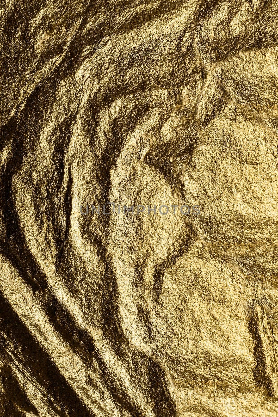 Texture or background. Background image heavily crumpled texture of gold foil