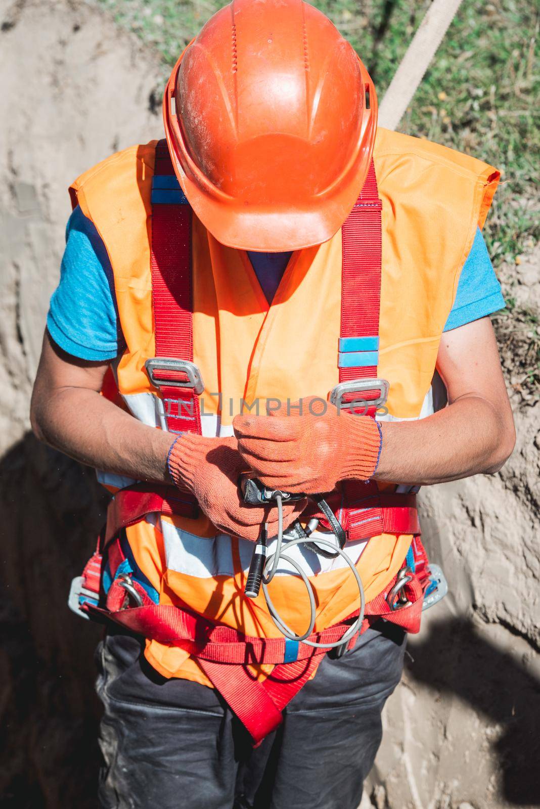 Close up of engineer in field checking device indicator. Gas servise on emergency call