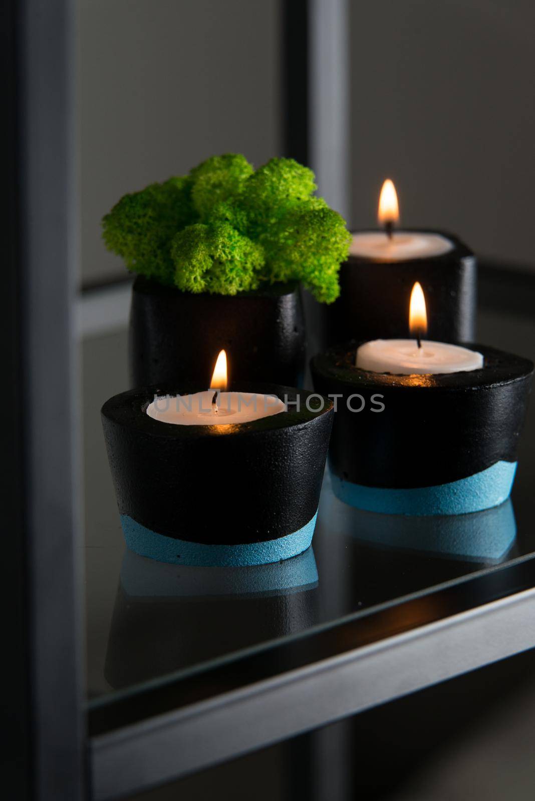 Candles and moss in black and blue concrete candle holders by Ashtray25