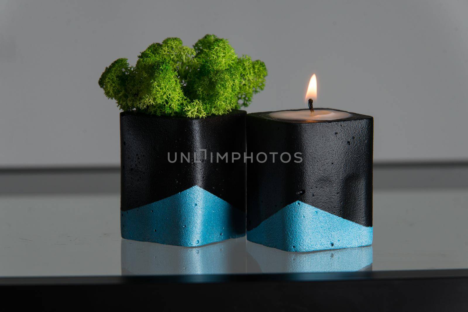 Candle and moss in black and blue concrete candle holders by Ashtray25