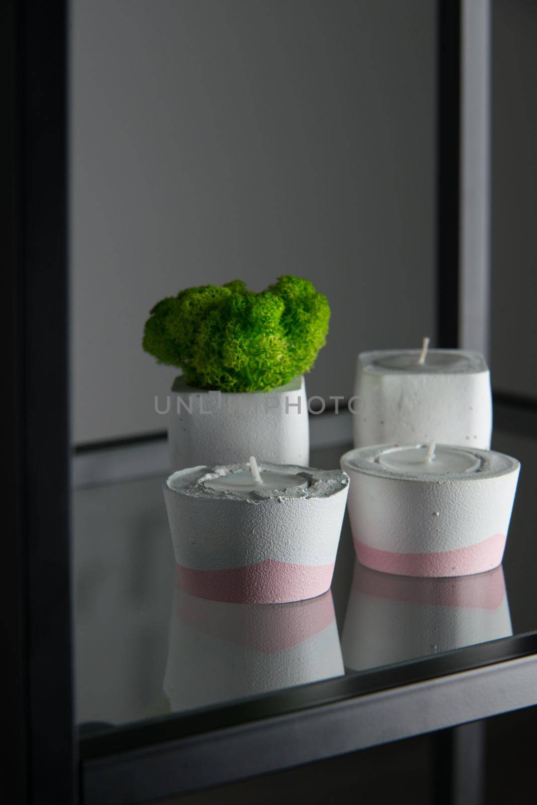 candles and moss in white and pink concrete candle holders by Ashtray25