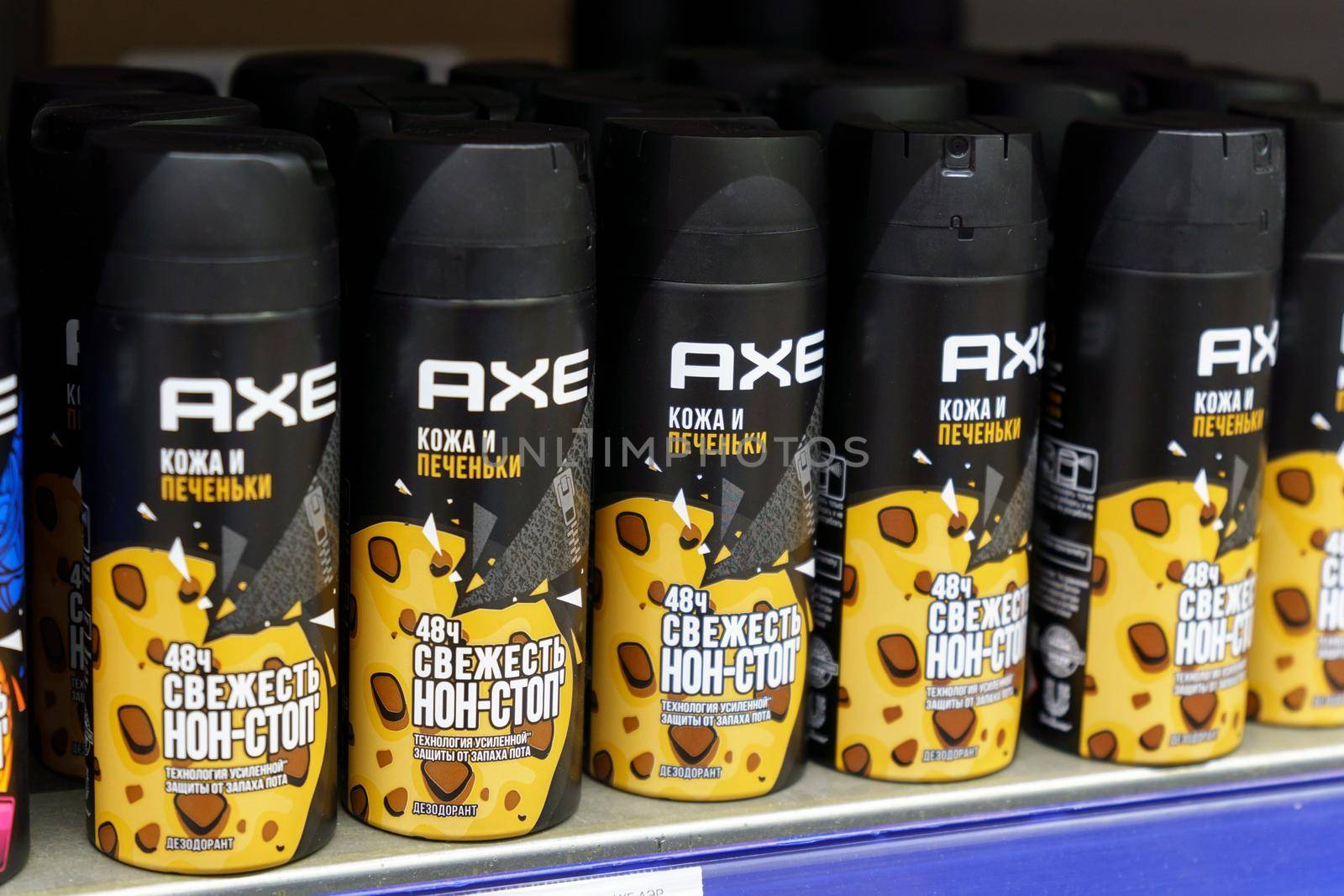 Tyumen, Russia-June 30, 2022: Spray of Axe deodorant skin and cookies on the shelves of the hypermarket. Local department store
