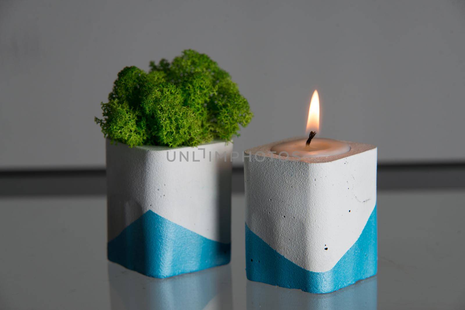 candle and moss in white and blue concrete candle holders by Ashtray25