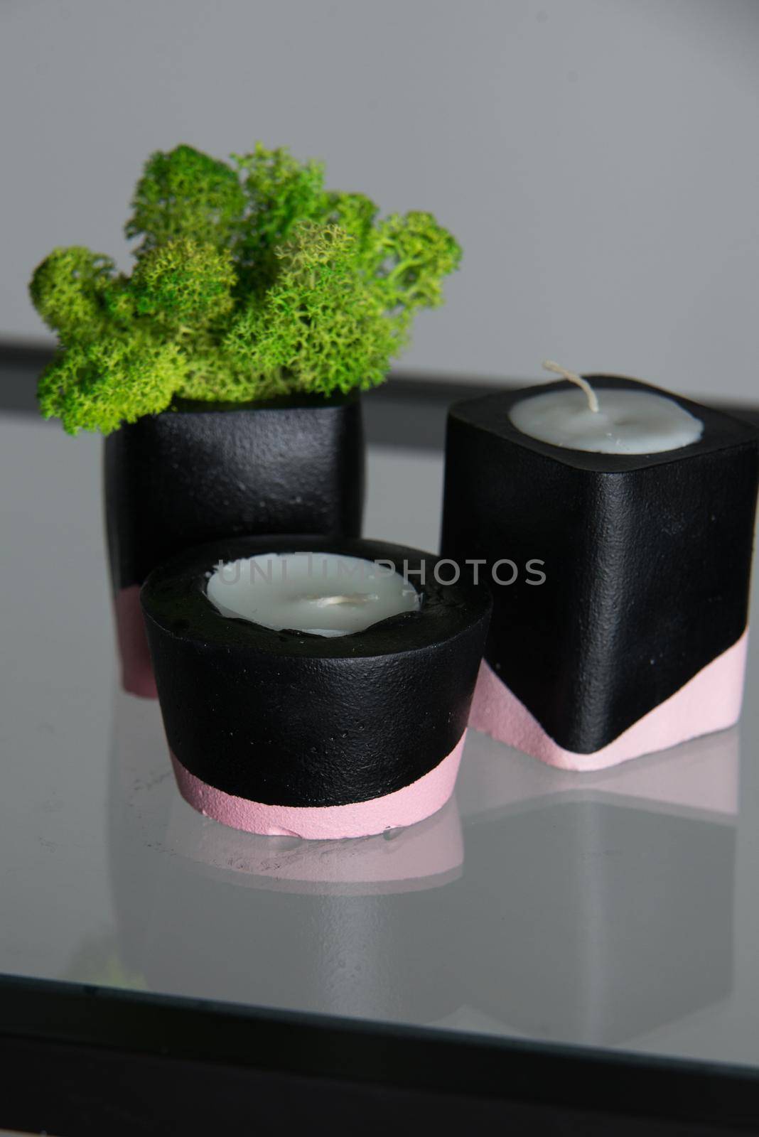 candles and moss in black and pink concrete candle holders by Ashtray25