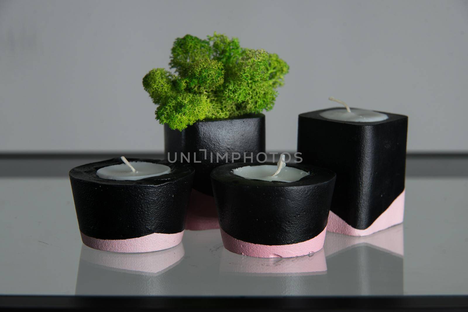 candles and moss in black and pink concrete candle holders by Ashtray25