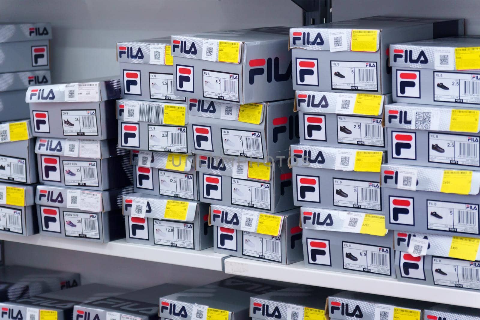 Tyumen, Russia-August 12, 2022: Fila boxes. Stylish and fashionable branded shoes for sale in a retail store.