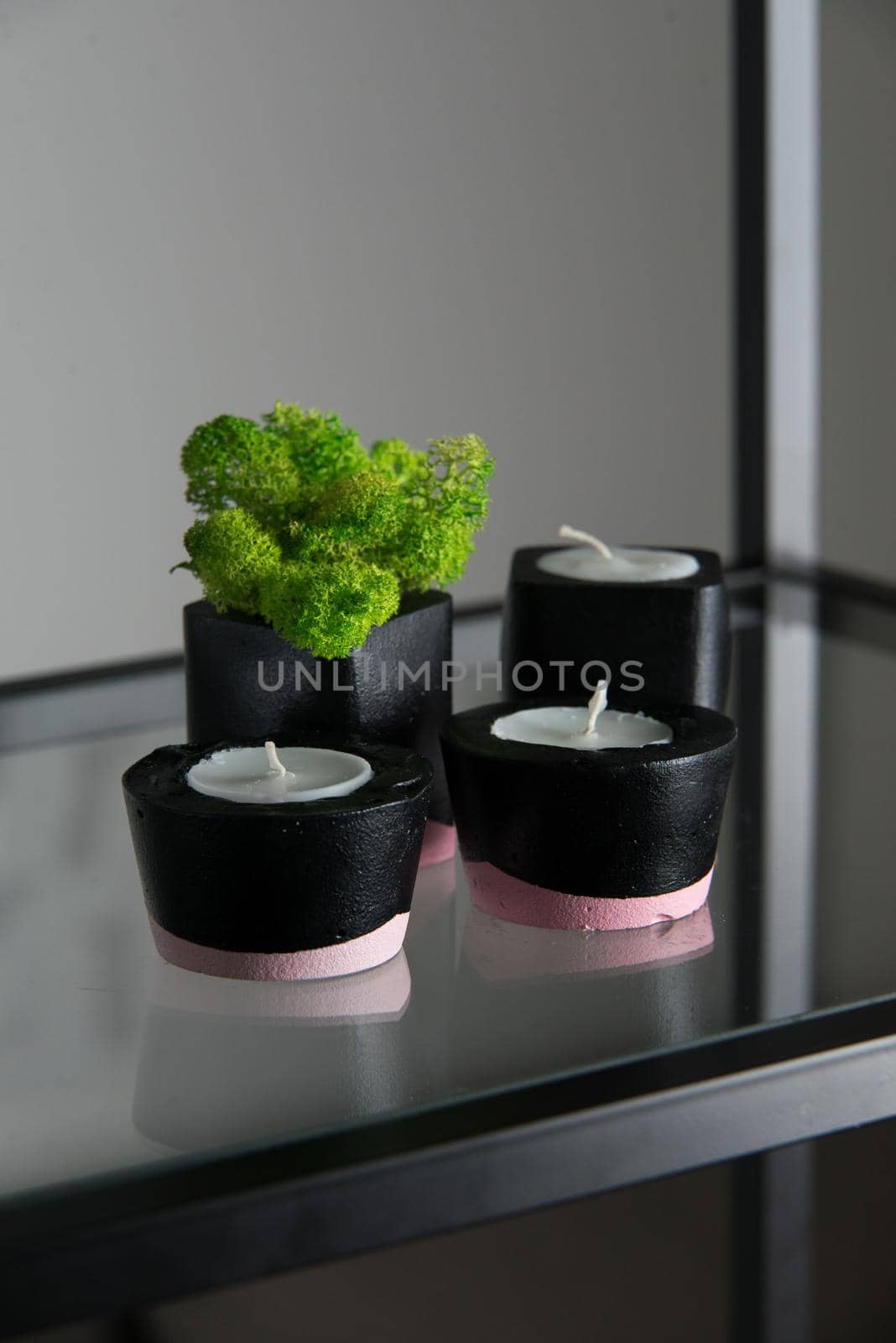 candles and moss in black and pink concrete candle holders by Ashtray25